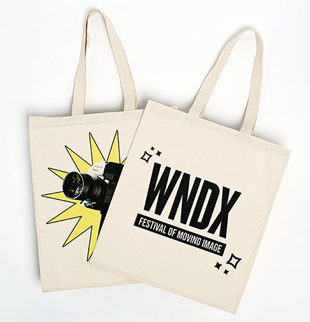 Two white tote bags featuring WNDX logo